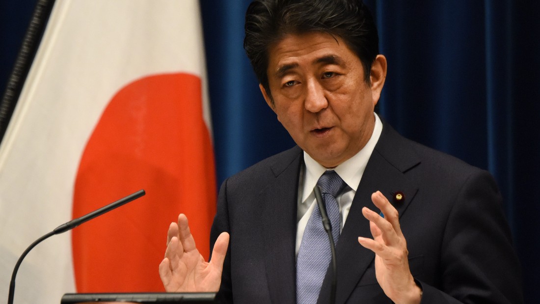 Japanese Prime Minister Shinzo Abe gestures as he answers questions following his war anniversary statement that neighbouring nations will scrutinise for signs of sufficient remorse over Tokyo&#39;s past militarism at his official residence in Tokyo on August 14, 2015.