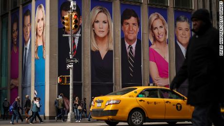 NEW YORK, NY - MARCH 13: Advertisements featuring Fox News personalities, including Tucker Carlson, adorn the front of the News Corporation building, March 13, 2019 in New York City. On Wednesday the network&#39;s sales executives are hosting an event for advertisers to promote Fox News. Fox News personalities Tucker Carlson and Jeanine Pirro have come under criticism in recent weeks for controversial comments and multiple advertisers have pulled away from their shows. (Photo by Drew Angerer/Getty Images)