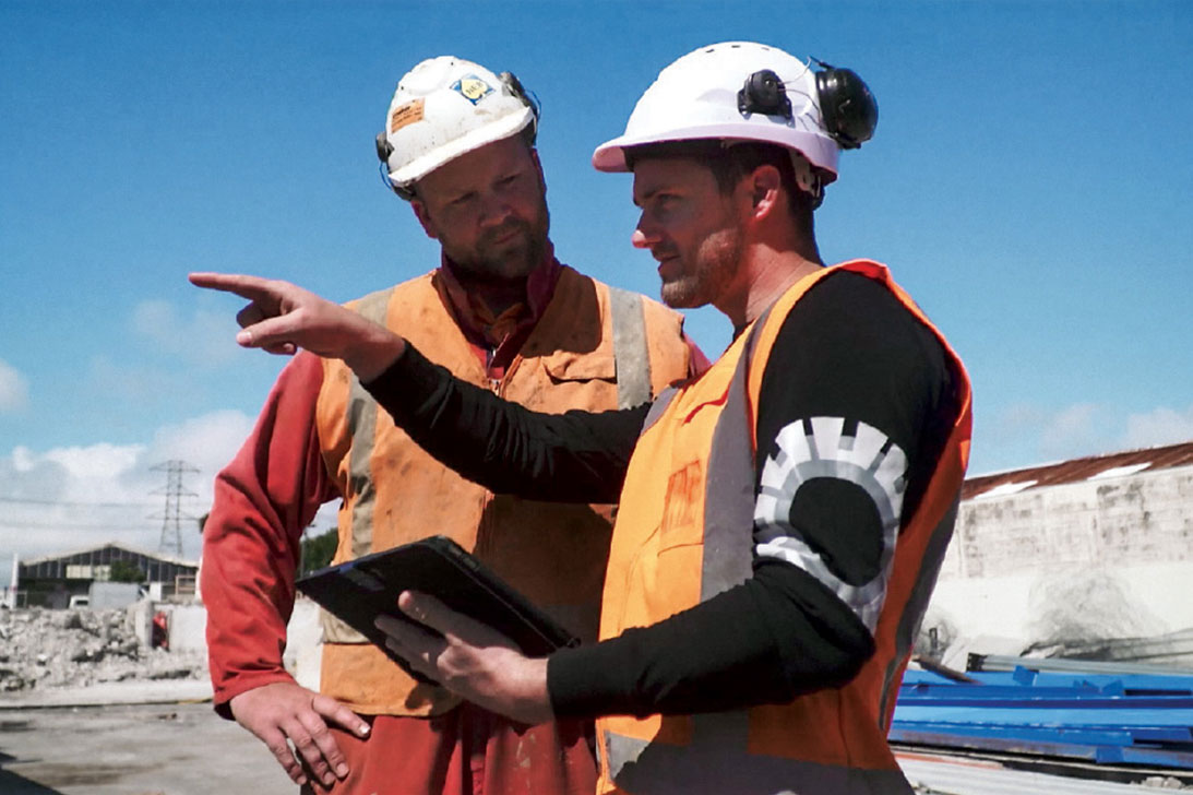 Image of Tradespeople at work with tablet