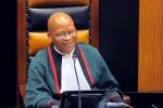 South African Chief Justice Mogoeng Mogoeng speaks during a session of parliament in Cape Town. (Photo by Rodger Bosch/AFP via Getty Images)