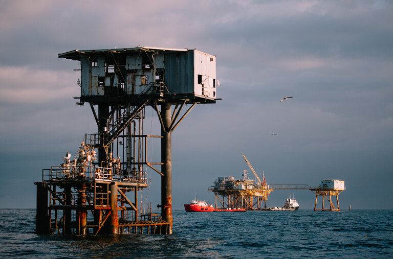 Oil platforms near Port Fourchon, La. Decades of drilling has left 14,000 old, unplugged wells in the Gulf of Mexico.