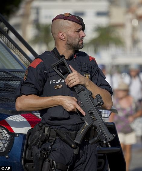 In Cambrils - the scene of the second terror attack - armed police are patrolling the streets and blood was being washed from the cobbled streets