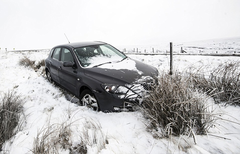 Icy conditions on the road meant that motorists around the country were forced to abandon their cars until the snow cleared (shown: one such car by the roadside in the Peak District)