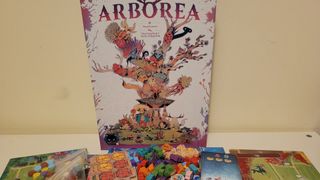 Arborea box and components laid out on a table, against a cream-colored wall