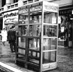 (Photo of phone booths with 911 instructions.)