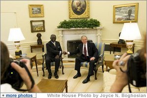 President George W. Bush and President John Agyekum Kufuor of Ghana pause for photos in the Oval Office prior to their meeting Monday, Sept. 15, 2008, at the White House. White House photo by Joyce N. Boghosian