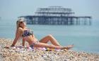 Lauren Heaps soaks up the sun on Brighton seafront, East Sussex