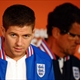 England's midfielder Steven Gerrard (L) and coach Fabio Capello arrive for a press conference