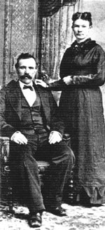 Man sitting and woman standing