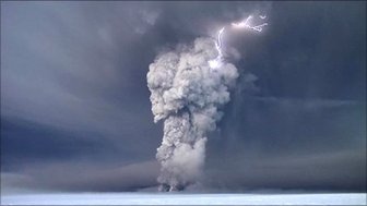 Lightening strikes as a volcano erupts