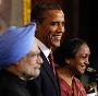 U.S. President Barack Obama, centre, is joined by India's Prime Minister Manmohan Singh, left, and the Speaker of the Lower House of Parliament Meira Kumar at Parliament House in New Delhi, 08 Nov 2010. 