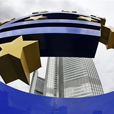 FILE - In this Sept. 2, 2009 file picture the Euro sculpture is photographed in front of the European Central Bank ECB in Frankfurt, central Germany. The European Central Bank raised its key interest rate by a quarter point, April 7, 2011, underlining its