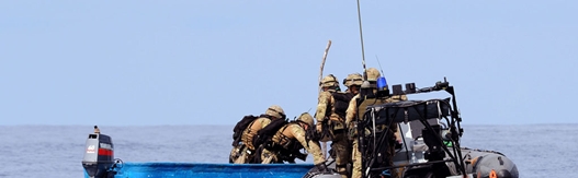 A Royal Marines boarding team embarked on RFA Fort Victoria capture a skiff suspected of piracy