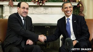Iraqi Prime Minister Nouri Maliki (L) shakes hands with US President Barack Obama