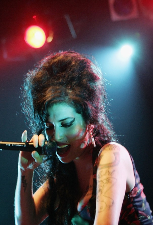 Just as her songs often suggested earlier eras of pop music, Winehouse's stage appearance was also something of a throwback. She revived fashion trends with her large beehive hairdo, heavy eyeliner, deep red lipstick, vintage skirts and high-heel pumps. Designer Karl Lagerfeld spoke flatteringly of her, saying she reminded him of Brigitte Bardot, the French sex symbol of the 1950s and '60s.