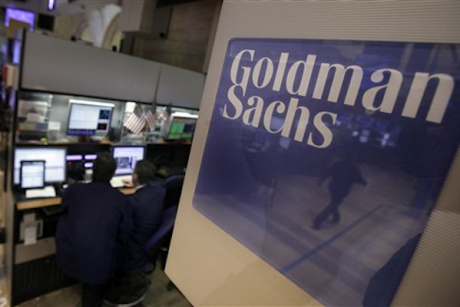 Traders work in the Goldman Sachs booth on the floor of the New York Stock Exchange Thursday, March 15, 2012