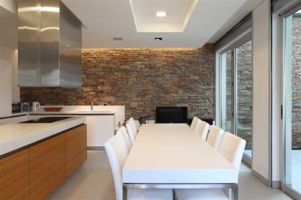 Kitchen and dining interior at Modern Home Design with Elevated Swimming Pool
