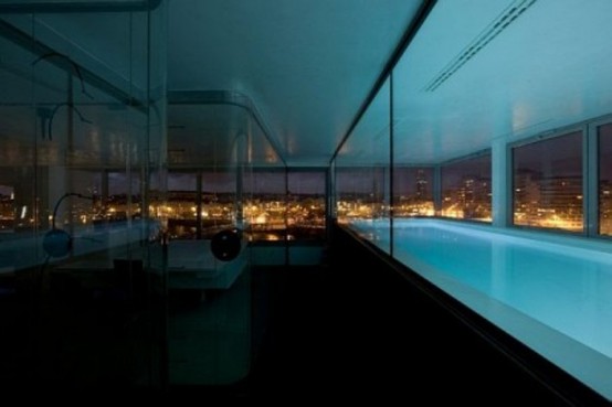 Indoor pool at Modern Penthouse Interior With Lot of Glass Windows and Door