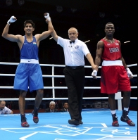 India's Vijender Singh is declared winner against Terrell Gausha of USA in the men's middleweight...