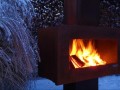in snowy Stylish Outdoor Fireplace by Zano