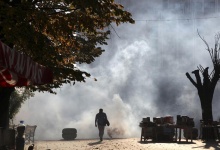 A protester from the Kosovo opposition party "Vetevendosja" (Self-determination) clashes with police forces during a demonstration in Pristina October 22, 2012. REUTERS/Hazir Reka