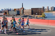 Runners of the elite women's pack cross the Pulaski Bridge from Brooklyn into Queens at the 2010 New York City Marathon.
