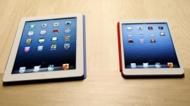 The new iPad mini is shown next to a full sized model at an Apple event in San Jose, California October 23, 2012. REUTERS/Robert Galbraith