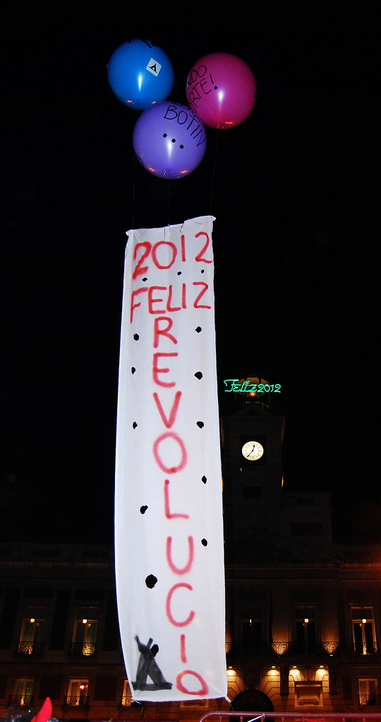A banner made by the Indignados for last New Year's celebration. (Flickr / Popicinio)