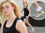 Too tired to put your trainers on? Elle Fanning hobbles out of dance class with her sneakers falling off her feet