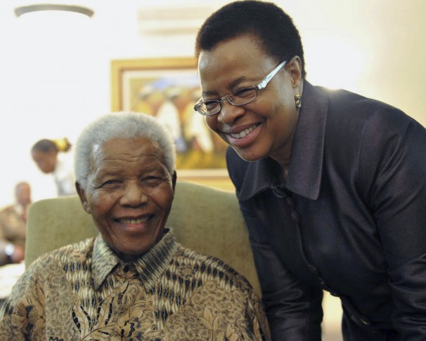 Nelson Mandela and his wife, Graca Machel, smile after casting early ballots in local elections in Johannesburg.