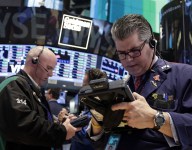 Stocks close mixed: Nasdaq gains, Dow retreats from record