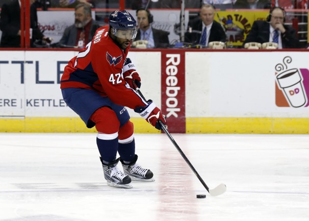 Washington Capitals right wing Joel Ward (42) skates with the puck in the first period of an NHL hockey game against the Los Angeles Kings, Tuesday, March 25, 2014, in Washington. (AP Photo/Alex Brandon)