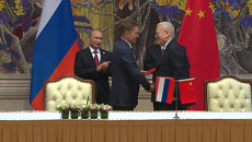 Газовый контракт, сотрудничество в военной сфере - итоги визита Путина в КНР