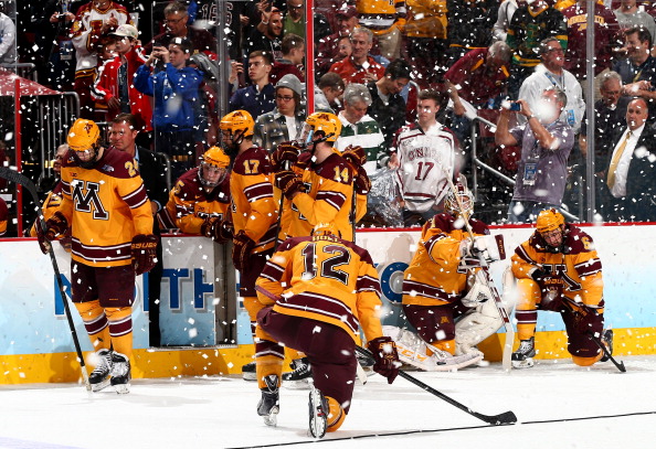 The University of Minnesota bench looks through the confetti as Union College celebrated their first national title with a 7-4 victory over the Gophers.