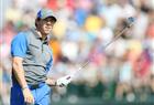 Rory McIlroy of Northern Ireland watches his shot off the 4th tee during the first round of the British Open Golf championship at the Royal Liverpool golf club in Hoylake, England, on Thursday July 17, 2014.