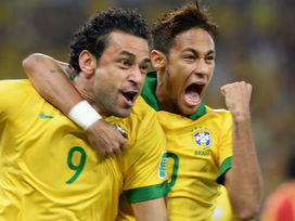 Fred, left, and Neymar celebrate after a goal in Brazil’s 3-0 victory over Spain to win its third straight Confederations Cup title on June 30 at Maracanã Stadium on June 30. Neymar had four goals in five games en route to be named the tournament’s best player. (Vanderlei Almeida/AFP)     
