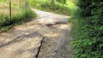 Un tratto di via Valpantena ormai senza asfalto: le buche si riempiono di acqua e diventano un pericolo