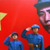 Chinese kids dressed in communist uniforms pose for a photo at a site used by former helmsman Mao Zedong and other leaders to discuss policy and future strategies in the Yangjialing Revolution, in Yan'an, Shaanxi Province, on April 6, 2014. (Photo: UPI/Stephen Shaver/Newscom)