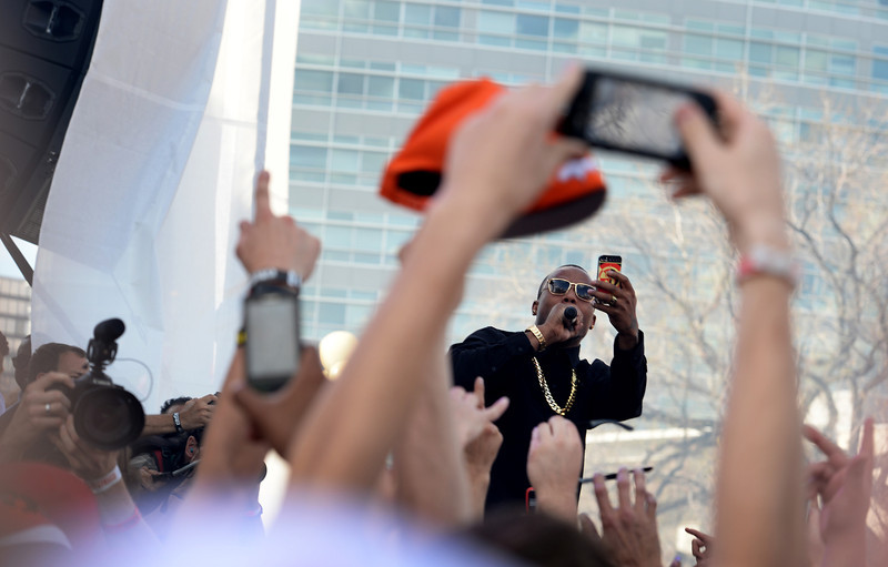 Rap singer B.o.B. takes pictures with a cell phone as he performed for thousands during the Colorado 420 Rally at Civic Center Park in Denver on April 20, 2014. Thousands of people lit up marijuana pipes, cigarettes, joints, and bongs at exactly 4:20 pm to celebrate the now legal use of marijuana in the state of Colorado. (Photo By Helen H. Richardson/ The Denver Post)