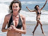 EXCLUSIVE TO INF.
August 16, 2015: Ex-model and reality TV star Janice Dickinson is in high spirits as she parades and frolics in a two-piece black bikini on the sands of Malibu, California.
Dickinson is one of more than 40 women who have accused comedian Bill Cosby of sexual assault. 
Mandatory Credit: Lazic/Borisio/INFphoto.com
Ref.: infusla-257/277