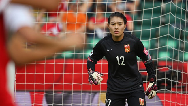  Wang Fei #12 of China PR defends her goal 