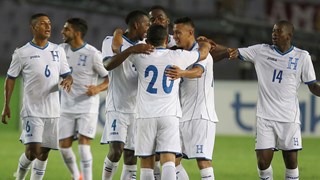 Honduras players celebrate their first goal against Venezuela 