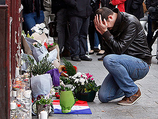 Tributes, Tears: Pictures from a Paris in Mourning