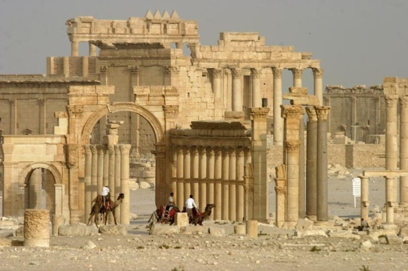 Columns and the ancient Temple of Bel are seen in the historical city of Palmyra, Syria, June 11, 2009. Satellite images have confirmed the destruction of the Temple of Bel, which was one of the best preserved Roman-era sites in the Syrian city of Palmyra, a United Nations agency said, after activists said the hardline Islamic State group had targeted it. The Syrian Observatory for Human Rights monitoring group and other activists said on August 30, 2015 that Islamic State had destroyed part of the more than 2,000-year-old temple, one of Palmyra's most important monuments. Picture taken June 11, 2009.   REUTERS/Gustau Nacarino - RTX1QLE5