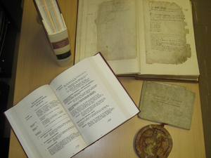 Group of items, including old and new volumes and parchment with seal