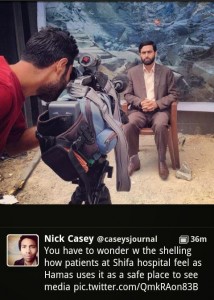 Mushir Al Masri, a Hamas MP and media spokesman, being interviewed by media in front of backdrop showing a destroyed house, and being filmed inside the Al Shifa hospital in Gaza. The photo was posted on Twitter by WSJ correspondent Nick Casey, and has since been removed. Photo: Screenshot.