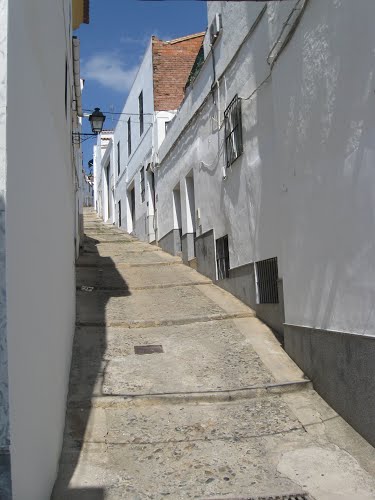 Narrow and steep street in Jerez de Los Caballeros, Spain