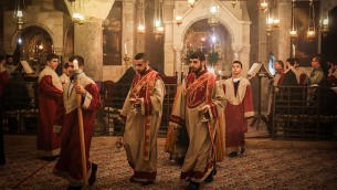Armenian Christian clergymen attend prayers on Palm Sunday, in the Church of the Holy Sepulchre, in Jerusalem's Old City, April 5, 2015. (Photo credit: Hadas Parush/FLASH90)