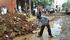 Residents of Thirumullavoyal at work on Pachaiamman Koil Main Road. Photo: Special Arrangement