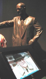Video monitor and bronze statue of George Halas.